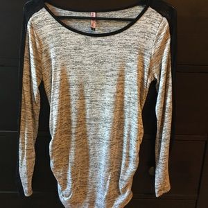 Grey top with lace sleeves.